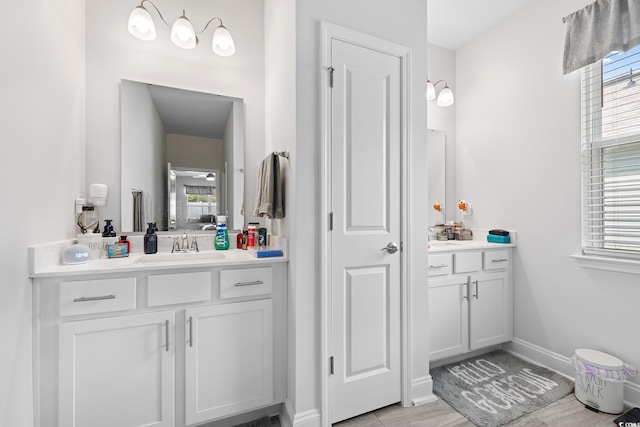 462 Pacific Commons Dr, Surfside Beach, SC 29575 - bathroom featuring vanity, baseboards, and wood finished floors