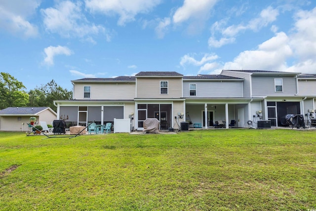 837 Triple Ct Unit 837, Myrtle Beach, SC 29588 - rear view of property with a sunroom and a yard