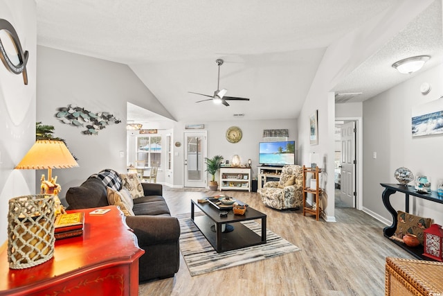 127 Coachman Ln, Surfside Beach, SC 29575 - living room with wood finished floors, ceiling fan, baseboards, and lofted ceiling
