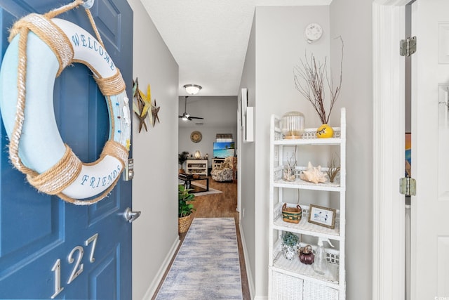 127 Coachman Ln, Surfside Beach, SC 29575 - hall featuring baseboards and wood finished floors