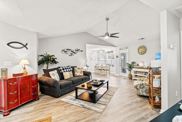 127 Coachman Ln, Surfside Beach, SC 29575 - living area with ceiling fan, wood finished floors, a textured ceiling, and vaulted ceiling