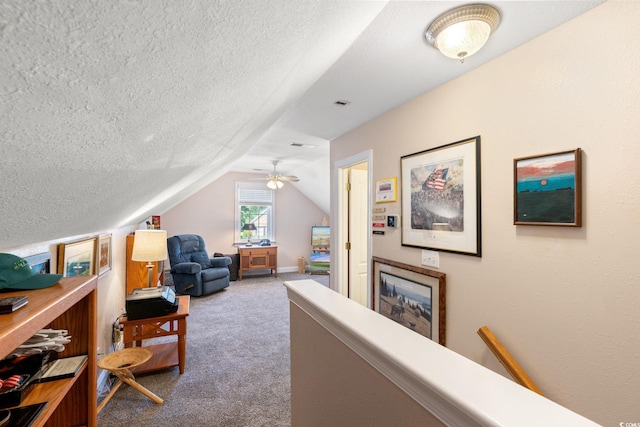 6572 Wellington Dr, Murrells Inlet, SC 29576 - living area featuring carpet floors, a textured ceiling, and vaulted ceiling