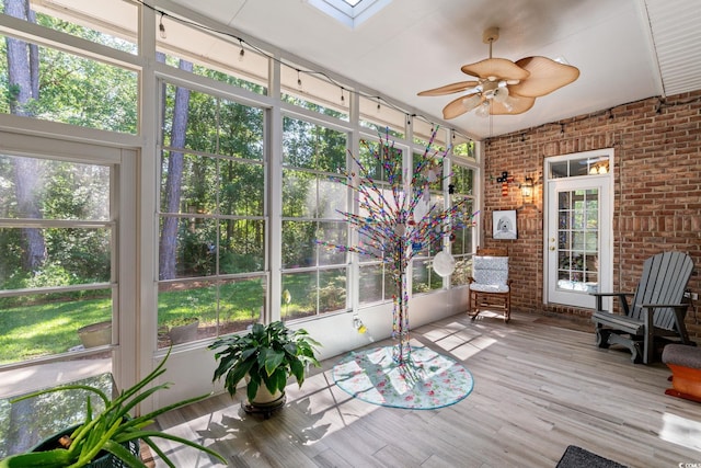 6572 Wellington Dr, Murrells Inlet, SC 29576 - unfurnished sunroom featuring ceiling fan and a skylight