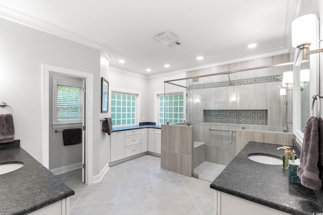 6572 Wellington Dr, Murrells Inlet, SC 29576 - bathroom with two vanities, ornamental molding, a shower stall, tile patterned flooring, and recessed lighting