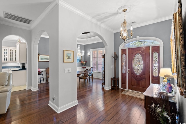6572 Wellington Dr, Murrells Inlet, SC 29576 - foyer entrance with a chandelier, healthy amount of natural light, dark wood finished floors, and ornamental molding