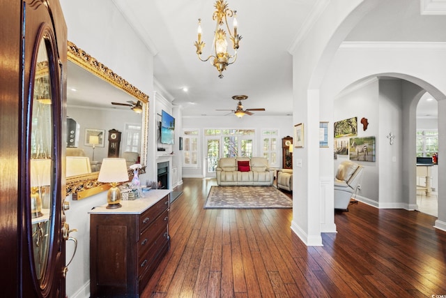 6572 Wellington Dr, Murrells Inlet, SC 29576 - entryway featuring ceiling fan, dark wood finished floors, healthy amount of natural light, and ornamental molding