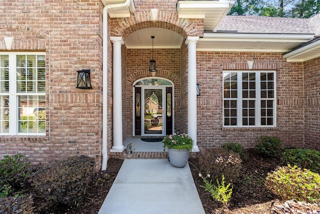 6572 Wellington Dr, Murrells Inlet, SC 29576 - doorway to property with brick siding and roof with shingles