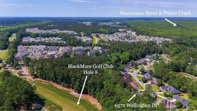 6572 Wellington Dr, Murrells Inlet, SC 29576 - aerial view of property and surrounding area with a heavily wooded area and nearby suburban area