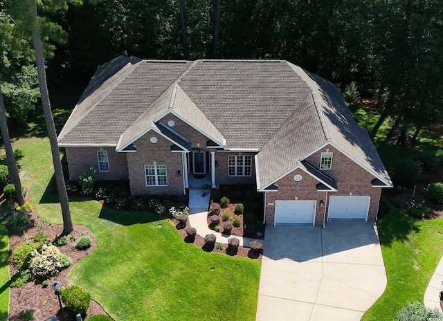 6572 Wellington Dr, Murrells Inlet, SC 29576 - view of front of property with brick siding, driveway, a garage, and a front yard