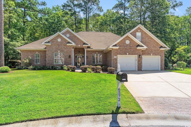 6572 Wellington Dr, Murrells Inlet, SC 29576 - view of front of property featuring driveway, brick siding, a front yard, an attached garage, and a shingled roof