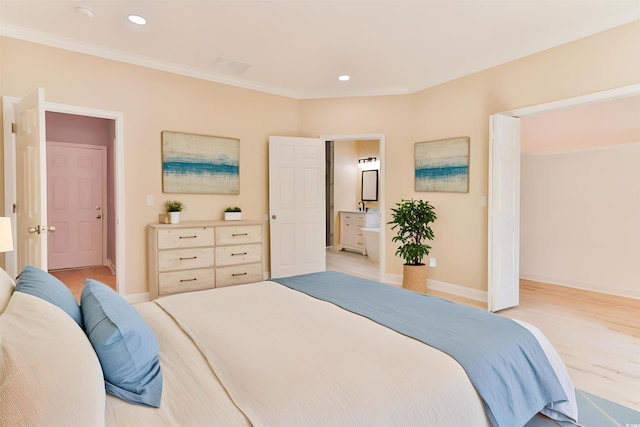 155 Mckenzie Cir, Pawleys Island, SC 29585 - bedroom with crown molding, ensuite bath, recessed lighting, and light wood-style floors