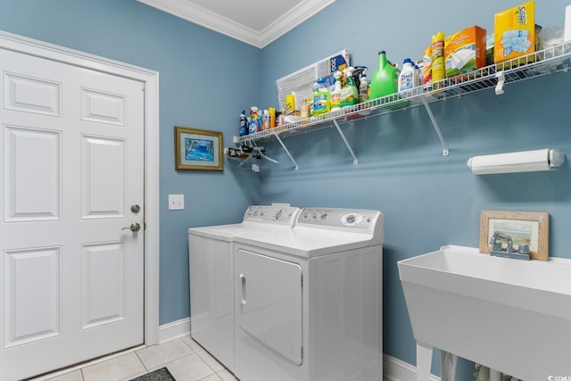 702 Compass Point Dr, North Myrtle Beach, SC 29582 - laundry room featuring separate washer and dryer, crown molding, light tile patterned floors, and baseboards