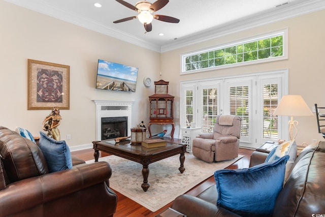 702 Compass Point Dr, North Myrtle Beach, SC 29582 - living area featuring a ceiling fan, wood finished floors, a fireplace, crown molding, and recessed lighting