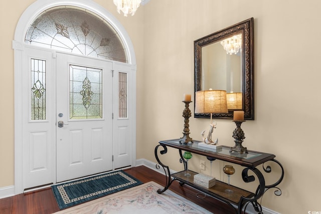 702 Compass Point Dr, North Myrtle Beach, SC 29582 - foyer featuring a chandelier, baseboards, and wood finished floors