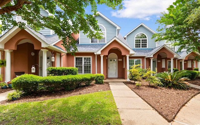 4505 Lightkeepers Way Unit 24B, Little River, SC 29566 - traditional home with roof with shingles and stucco siding