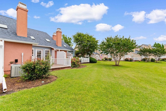 4505 Lightkeepers Way Unit 24B, Little River, SC 29566 - view of green lawn with central air condition unit and a wooden deck