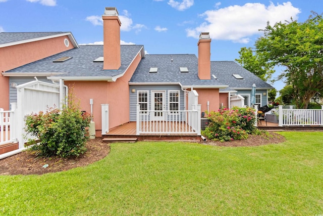 4505 Lightkeepers Way Unit 24B, Little River, SC 29566 - back of property featuring a wooden deck, a chimney, roof with shingles, and stucco siding