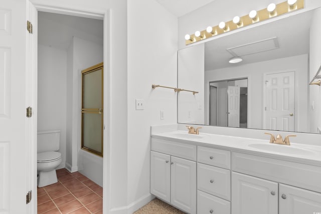 4505 Lightkeepers Way Unit 24B, Little River, SC 29566 - full bathroom featuring double vanity, toilet, tile patterned floors, enclosed tub / shower combo, and baseboards