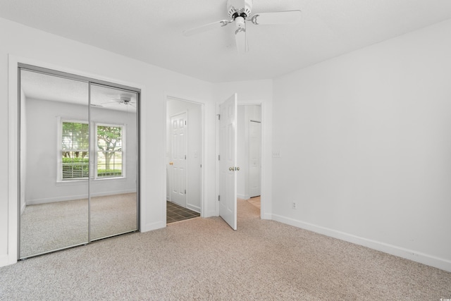 4505 Lightkeepers Way Unit 24B, Little River, SC 29566 - unfurnished bedroom featuring carpet flooring, baseboards, a closet, and a ceiling fan