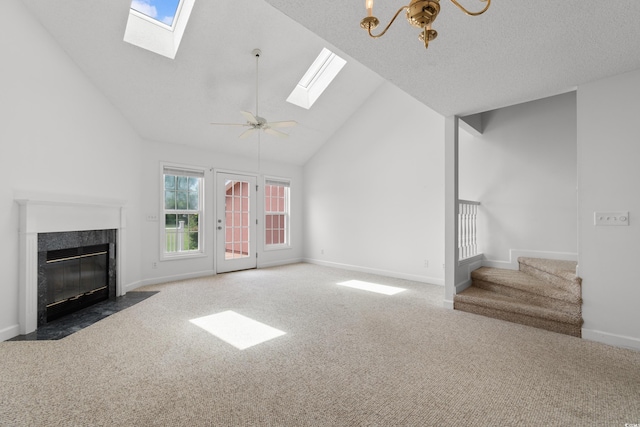 4505 Lightkeepers Way Unit 24B, Little River, SC 29566 - unfurnished living room with a skylight, carpet flooring, high vaulted ceiling, baseboards, and stairs