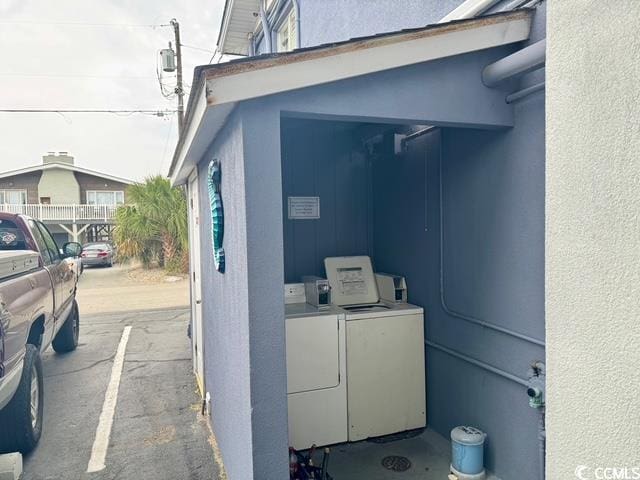 5409 N Ocean Blvd Unit 111, North Myrtle Beach, SC 29582 - exterior space featuring washing machine and clothes dryer and stucco siding