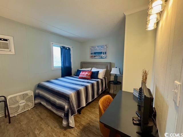 5409 N Ocean Blvd Unit 111, North Myrtle Beach, SC 29582 - bedroom featuring dark wood-style floors