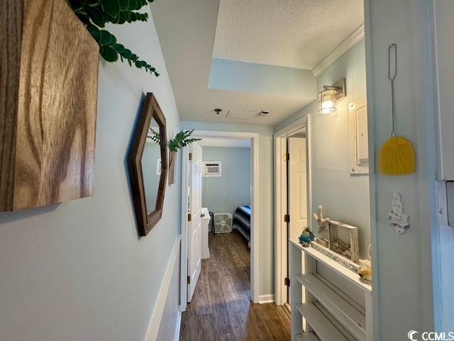 5409 N Ocean Blvd Unit 111, North Myrtle Beach, SC 29582 - corridor with dark wood-style floors and a textured ceiling