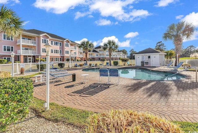 4811 Orchid Way Unit 301, Myrtle Beach, SC 29577 - community pool featuring a patio and a residential view