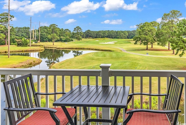 4811 Orchid Way Unit 301, Myrtle Beach, SC 29577 - balcony featuring a water view, view of golf course, view of scattered trees, and outdoor dining area