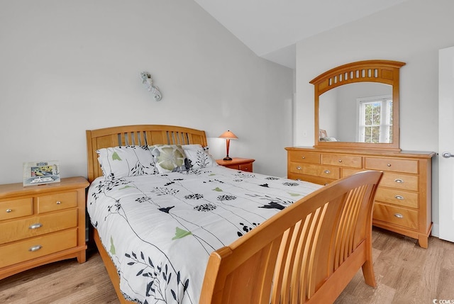 4811 Orchid Way Unit 301, Myrtle Beach, SC 29577 - bedroom featuring light wood-style floors and vaulted ceiling