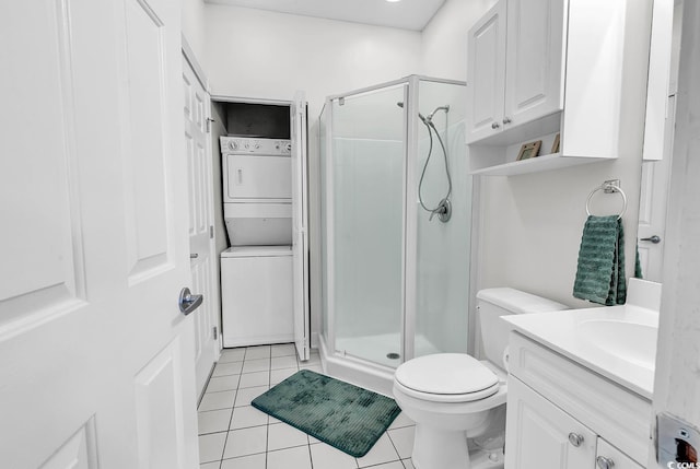 4811 Orchid Way Unit 301, Myrtle Beach, SC 29577 - full bathroom featuring estacked washer and dryer, vanity, a shower stall, and tile patterned flooring