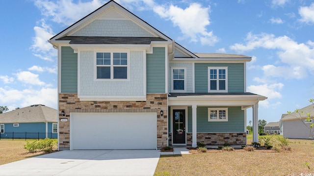 744 Choctaw Dr, Conway, SC 29526 - craftsman-style home featuring stone siding, concrete driveway, a porch, and an attached garage
