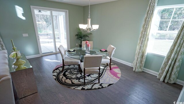744 Choctaw Dr, Conway, SC 29526 - dining area with a chandelier, wood finished floors, and baseboards
