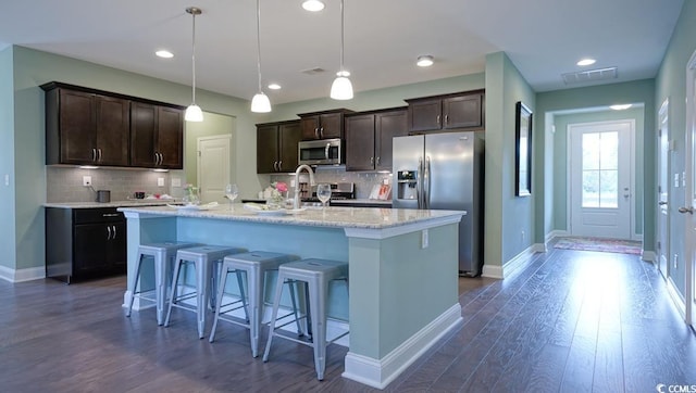 744 Choctaw Dr, Conway, SC 29526 - kitchen with stainless steel appliances, dark brown cabinets, baseboards, decorative backsplash, and recessed lighting