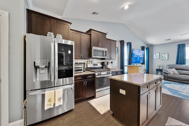 5475 Elba Way Unit 1601, Myrtle Beach, SC 29579 - kitchen featuring stainless steel appliances, lofted ceiling, open floor plan, dark brown cabinets, and dark wood-style floors