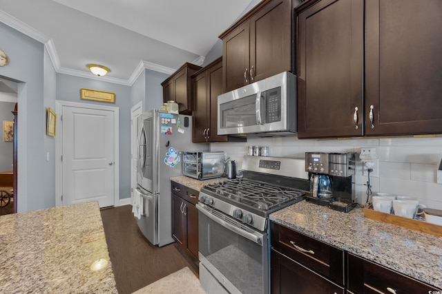 5475 Elba Way Unit 1601, Myrtle Beach, SC 29579 - kitchen with appliances with stainless steel finishes, dark wood-type flooring, dark brown cabinets, tasteful backsplash, and crown molding