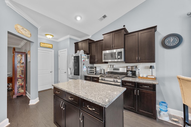 5475 Elba Way Unit 1601, Myrtle Beach, SC 29579 - kitchen featuring stainless steel appliances, crown molding, wood finished floors, dark brown cabinetry, and a kitchen island