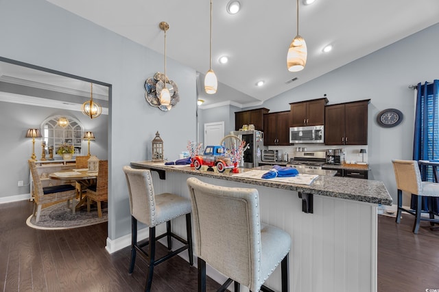 5475 Elba Way Unit 1601, Myrtle Beach, SC 29579 - kitchen featuring appliances with stainless steel finishes, a breakfast bar area, dark brown cabinetry, crown molding, and vaulted ceiling