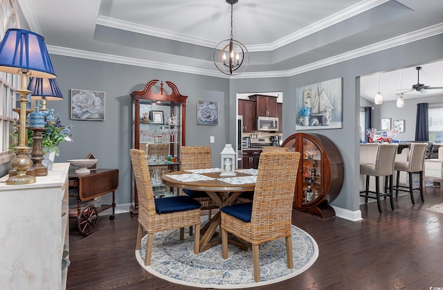 5475 Elba Way Unit 1601, Myrtle Beach, SC 29579 - dining space featuring dark wood-type flooring, a tray ceiling, a chandelier, and ornamental molding