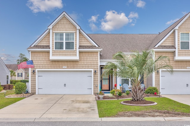 5475 Elba Way Unit 1601, Myrtle Beach, SC 29579 - view of front of house with concrete driveway, an attached garage, a shingled roof, and a front yard