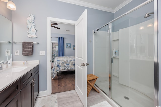 5475 Elba Way Unit 1601, Myrtle Beach, SC 29579 - ensuite bathroom featuring crown molding, vanity, a shower stall, and wood finished floors