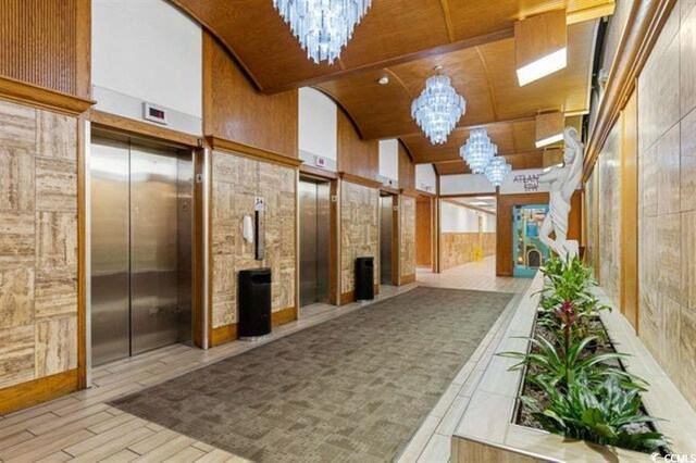 9550 Shore Dr Unit 1524, Myrtle Beach, SC 29572 - common area featuring vaulted ceiling, wooden walls, and wooden ceiling