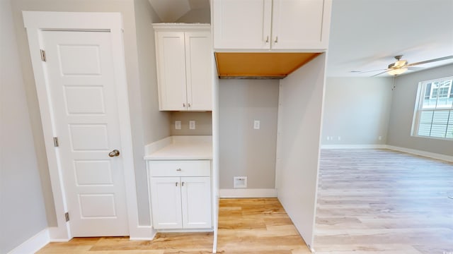 52 Fish Shack Aly, Murrells Inlet, SC 29576 - kitchen with a ceiling fan, light wood finished floors, white cabinets, and light countertops