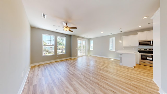 52 Fish Shack Aly, Murrells Inlet, SC 29576 - unfurnished living room with light wood-style floors, ceiling fan, and recessed lighting