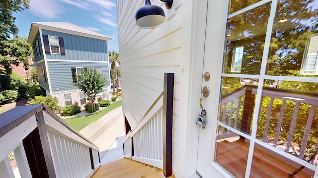 52 Fish Shack Aly, Murrells Inlet, SC 29576 - view of exterior entry with board and batten siding and a metal roof