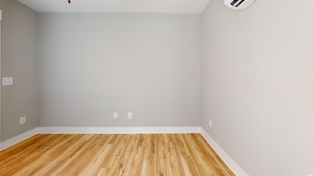 52 Fish Shack Aly, Murrells Inlet, SC 29576 - spare room with wood finished floors and a wall mounted air conditioner