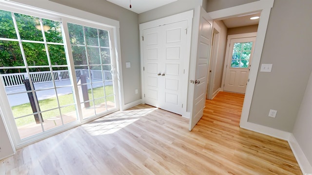 52 Fish Shack Aly, Murrells Inlet, SC 29576 - doorway to outside with baseboards and light wood finished floors