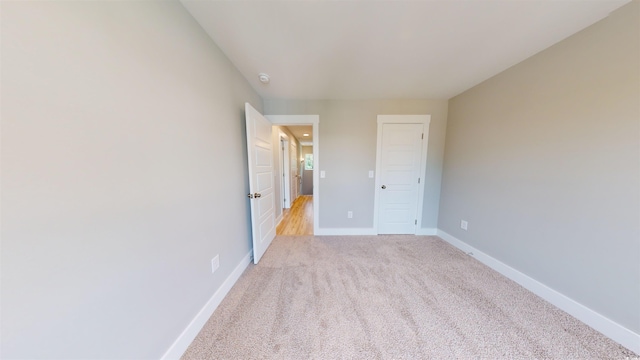52 Fish Shack Aly, Murrells Inlet, SC 29576 - unfurnished bedroom featuring light carpet and baseboards