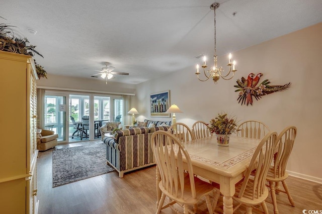601 Hillside Dr N Unit 3704, North Myrtle Beach, SC 29582 - dining area featuring light wood finished floors, a chandelier, a ceiling fan, and baseboards