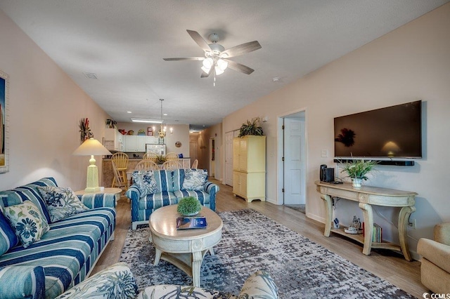 601 Hillside Dr N Unit 3704, North Myrtle Beach, SC 29582 - living room with ceiling fan, light wood finished floors, a chandelier, lofted ceiling, and baseboards